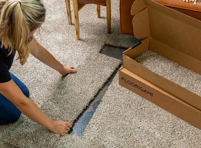 woman installing floorigami carpet